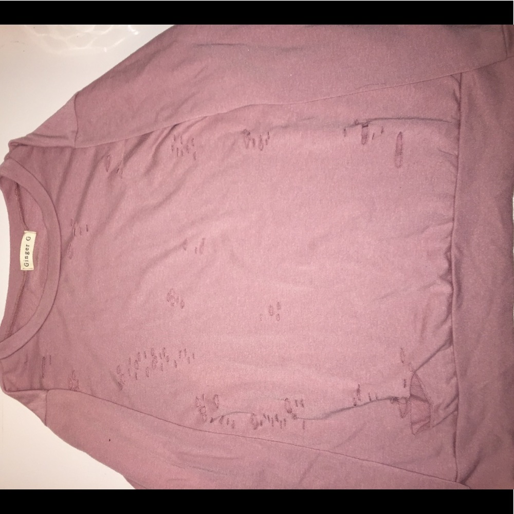 pink long sleeve shirt with holes